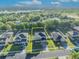 Aerial view of property showing layout, landscaping, and location relative to the lake and surrounding community at 10219 Lenox St, Clermont, FL 34711