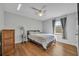 Bedroom with a comfortable bed, a ceiling fan, and a side table at 10219 Lenox St, Clermont, FL 34711