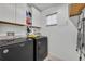 Laundry room with a washer and dryer and built in shelving at 10219 Lenox St, Clermont, FL 34711