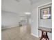 Bright living room featuring tile floors and large windows that provide ample natural light at 10219 Lenox St, Clermont, FL 34711