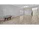Bright living room featuring tile floors and large windows that provide ample natural light at 10219 Lenox St, Clermont, FL 34711