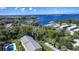 Stunning aerial view of the property showcasing water views and lush landscaping at 110 N Tremain St # 205, Mount Dora, FL 32757
