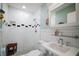 Modern bathroom features a walk-in shower, white tile, and modern vanity at 110 N Tremain St # 205, Mount Dora, FL 32757