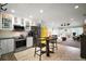 Bright open floor plan with modern kitchen featuring stainless steel appliances and open to living room at 110 N Tremain St # 205, Mount Dora, FL 32757