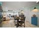 Open concept living and kitchen combo with a hardwood floor and a large gathering space at 110 N Tremain St # 205, Mount Dora, FL 32757