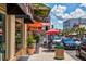 View of the street with shops, restaurants, and outdoor seating at 110 N Tremain St # 205, Mount Dora, FL 32757