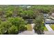 Aerial view of the home nestled amongst mature trees and landscaping at 1107 Valley Rd, Fruitland Park, FL 34731