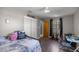 This bedroom features a small workspace, closet, and decorative pillows at 1107 Valley Rd, Fruitland Park, FL 34731