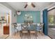Cozy dining room with seating for six and views of the outdoors at 1107 Valley Rd, Fruitland Park, FL 34731