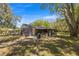 Home exterior showcasing the large patio and backyard at 1107 Valley Rd, Fruitland Park, FL 34731