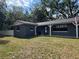 Charming single story home with a covered front porch and manicured lawn at 1107 Valley Rd, Fruitland Park, FL 34731