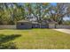 Inviting single-story home featuring a well-maintained lawn and attached garage at 1107 Valley Rd, Fruitland Park, FL 34731