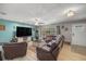 Spacious living room with ample natural light, ceiling fan, and neutral color scheme at 1107 Valley Rd, Fruitland Park, FL 34731