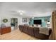 Comfortable living room with a large sectional sofa, ceiling fan, and backyard view at 1107 Valley Rd, Fruitland Park, FL 34731