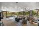 Relaxing screened patio featuring a spa and comfortable seating area at 1107 Valley Rd, Fruitland Park, FL 34731