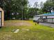 Expansive backyard with a wooden deck, perfect for outdoor gatherings at 11252 Country Haven Dr, Lakeland, FL 33809
