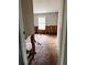 Damaged room shows exposed wall frame, plywood floors, and debris at 11252 Country Haven Dr, Lakeland, FL 33809