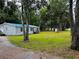 Charming single-story home with a spacious yard and mature trees at 11252 Country Haven Dr, Lakeland, FL 33809
