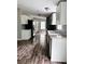 Bright kitchen featuring white cabinets, stainless steel appliances, and modern countertops at 11252 Country Haven Dr, Lakeland, FL 33809