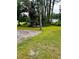Expansive grassy lot with mature trees and a wooden structure in the distance at 11252 Country Haven Dr, Lakeland, FL 33809