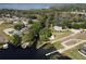 Aerial view of homes located on canals leading to a lake, docks and boat slips are visible at each property at 11312 Haskell Dr, Clermont, FL 34711