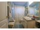 Bright bathroom with a classic vanity, coordinated accessories, and a clean, inviting aesthetic at 11312 Haskell Dr, Clermont, FL 34711