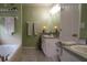 Cozy bathroom featuring a tub, a vanity with sink, and tiled floors at 11312 Haskell Dr, Clermont, FL 34711