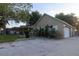 This property offers a long driveway leading to an oversized garage, complemented by landscaping and ample parking space at 11312 Haskell Dr, Clermont, FL 34711