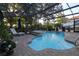 Enclosed backyard pool with hot tub and deck, perfect for private relaxation and entertainment at 11312 Haskell Dr, Clermont, FL 34711