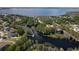 Aerial view of waterfront homes, canals leading to a lake with private docks and boat slips at 11312 Haskell Dr, Clermont, FL 34711