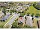 Aerial view of a home in a residential community featuring a red pin location marker at 117 Falling Acorn Ave, Groveland, FL 34736