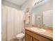 Standard bathroom featuring a shower/tub, a toilet, and a vanity sink at 117 Falling Acorn Ave, Groveland, FL 34736