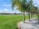 Well-manicured backyard with mature landscaping and views of the adjacent golf course at 12136 Se 176Th Loop, Summerfield, FL 34491