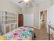 Bedroom with closet, wood floor and views into hall and doorway at 12136 Se 176Th Loop, Summerfield, FL 34491