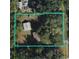 A birds eye view of the home and property with a defined perimeter line at 136 S Commercial St, Coleman, FL 33521