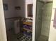 Functional bathroom with a walk-in shower and a stylish vanity unit at 136 S Commercial St, Coleman, FL 33521