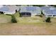 Aerial shot featuring the backyard, solar panels, and an inviting screened-in lanai at 142 Bayou Bend Rd, Groveland, FL 34736