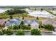 A beautifully landscaped home with a two car garage near a lake promotes a luxurious and comfortable lifestyle at 142 Bayou Bend Rd, Groveland, FL 34736