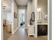 Hallway featuring neutral walls, tile flooring, and access to bedrooms and bathrooms at 142 Bayou Bend Rd, Groveland, FL 34736