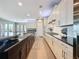 Spacious kitchen with a long island, stainless steel appliances, and plenty of counter space at 142 Bayou Bend Rd, Groveland, FL 34736