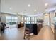 Open-concept kitchen with a large island, stainless steel appliances, and view of the living area at 142 Bayou Bend Rd, Groveland, FL 34736