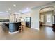 Modern kitchen with an island, stainless steel appliances, and ample cabinet space at 142 Bayou Bend Rd, Groveland, FL 34736