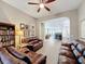 Inviting living room with open layout and views to the kitchen and dining area at 142 Bayou Bend Rd, Groveland, FL 34736