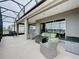 Outdoor patio with water view, comfortable seating, and grill, ideal for relaxing at 142 Bayou Bend Rd, Groveland, FL 34736