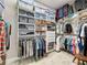 Bright and organized walk-in closet with custom shelving and ample storage space at 142 Bayou Bend Rd, Groveland, FL 34736