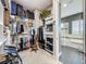 Spacious walk-in closet with ample shelving, storage, and direct access to the ensuite bathroom at 142 Bayou Bend Rd, Groveland, FL 34736