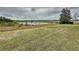 Serene water view provides a peaceful backdrop, enhances the home's appeal with natural beauty at 142 Bayou Bend Rd, Groveland, FL 34736