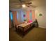 Cozy bedroom featuring a ceiling fan and bright, colorful decor at 15159 Sw 43Rd Terrace Rd, Ocala, FL 34473