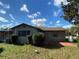 Exterior view of a single-story house with a well-maintained lawn at 15159 Sw 43Rd Terrace Rd, Ocala, FL 34473
