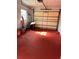 Clean garage featuring a red floor at 15159 Sw 43Rd Terrace Rd, Ocala, FL 34473